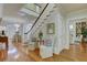 Spacious foyer with a staircase, hardwood floors, and elegant decor at 418 W Carolina Ave, Summerville, SC 29483