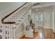 Entryway with hardwood floors, staircase, and decorative furniture and decor at 418 W Carolina Ave, Summerville, SC 29483