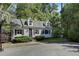 Charming two-story home with dormer windows and a beautifully landscaped front yard at 418 W Carolina Ave, Summerville, SC 29483