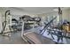 Well-equipped home gym with a treadmill, weights, and mirrored walls for exercise and fitness at 418 W Carolina Ave, Summerville, SC 29483