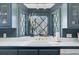 Kitchen sink under bay window with diamond patterned panes and white tile countertops at 418 W Carolina Ave, Summerville, SC 29483