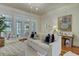 Comfortable living room with a white sofa, hardwood floors, and access to a patio at 418 W Carolina Ave, Summerville, SC 29483