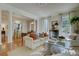 Spacious living area featuring a glass coffee table on zebra hide rug and comfortable sofa under natural light at 418 W Carolina Ave, Summerville, SC 29483