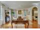 Bright living room with a fireplace, hardwood floors, and elegant furnishings, creating a comfortable atmosphere at 418 W Carolina Ave, Summerville, SC 29483