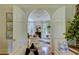 Bright living room featuring an arched doorway, zebra rug, white sofas, and decorative pillows at 418 W Carolina Ave, Summerville, SC 29483