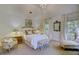 Main bedroom with a comfortable bed, neutral decor, and an abundance of natural light at 418 W Carolina Ave, Summerville, SC 29483