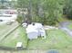 An aerial view of the home showcasing the large yard and storage shed at 49 Auld Brass Rd, Walterboro, SC 29488