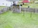 An overhead view of a backyard with a playset and fenced in area at 49 Auld Brass Rd, Walterboro, SC 29488