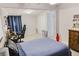 Cozy bedroom featuring a comfortable bed, gaming setup, and carpeted floor at 49 Auld Brass Rd, Walterboro, SC 29488