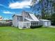 Exterior featuring a gray house with a large yard, patio, and detached garage at 49 Auld Brass Rd, Walterboro, SC 29488