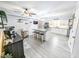 Bright kitchen features an island with granite countertops, white cabinetry, and stainless steel appliances at 49 Auld Brass Rd, Walterboro, SC 29488