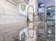 Close-up of a modern kitchen sink with granite countertops and subway tile backsplash at 49 Auld Brass Rd, Walterboro, SC 29488