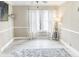 Bright living room features stylish neutral decor, with a large window providing abundant natural light at 49 Auld Brass Rd, Walterboro, SC 29488