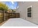 Backyard concrete patio with a wood fence surrounding the perimeter for privacy at 5022 W Liberty Meadows Dr, Summerville, SC 29485