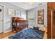 Bedroom with hardwood flooring, natural light, and blue rug at 5022 W Liberty Meadows Dr, Summerville, SC 29485