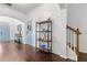 Hardwood foyer featuring decorative shelving and a beautiful blue door at 5022 W Liberty Meadows Dr, Summerville, SC 29485