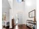 Bright foyer with high ceilings, stylish decor, and hardwood floors create a welcoming entrance at 5022 W Liberty Meadows Dr, Summerville, SC 29485