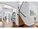 Inviting entryway with a wooden staircase, hardwood floors, and stylish decor at 5022 W Liberty Meadows Dr, Summerville, SC 29485