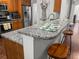 Kitchen bar with barstools and granite countertops, perfect for casual dining and entertaining at 5022 W Liberty Meadows Dr, Summerville, SC 29485