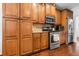 Modern kitchen showcasing stainless steel appliances, granite countertops, tile backsplash, and ample storage at 5022 W Liberty Meadows Dr, Summerville, SC 29485