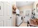 Well-organized laundry room with modern washer, dryer, and convenient storage at 5022 W Liberty Meadows Dr, Summerville, SC 29485