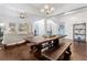 Open concept living room with hardwood floors, white walls, modern lighting and light blue doors at 5022 W Liberty Meadows Dr, Summerville, SC 29485