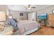 Large main bedroom with hardwood floors, a stylish bed, and a view into the hallway and other living areas at 5022 W Liberty Meadows Dr, Summerville, SC 29485
