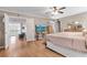Spacious main bedroom featuring hardwood floors, neutral tones, and a connecting door to other living spaces at 5022 W Liberty Meadows Dr, Summerville, SC 29485