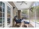 Relaxing screened-in porch with brick flooring and comfortable seating. Perfect for outdoor living! at 5022 W Liberty Meadows Dr, Summerville, SC 29485