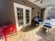 Relaxing screened-in porch with brick flooring and comfortable seating. The perfect place to hang out! at 5022 W Liberty Meadows Dr, Summerville, SC 29485