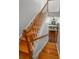 Elegant staircase with wood treads and white risers leading to a cozy living area with a fireplace at 5022 W Liberty Meadows Dr, Summerville, SC 29485