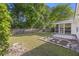 A spacious fenced backyard with a screened porch and a garden at 527 Hainsworth Dr, Charleston, SC 29414