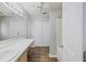 Bright bathroom with wood-look floors, ample counter space, and a shower-tub combo at 527 Hainsworth Dr, Charleston, SC 29414