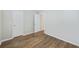 Bedroom featuring light grey walls, wood-look floors, and double closet doors at 527 Hainsworth Dr, Charleston, SC 29414