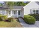 Inviting home facade with a well-manicured lawn and mature landscaping at 527 Hainsworth Dr, Charleston, SC 29414