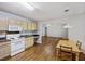 Kitchen with appliances and eat-in area looks into the living room at 527 Hainsworth Dr, Charleston, SC 29414