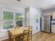 The kitchen dining area is adjacent to the door to the backyard at 527 Hainsworth Dr, Charleston, SC 29414