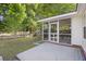 View of a screened in porch and the fenced backyard at 527 Hainsworth Dr, Charleston, SC 29414