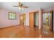 Bedroom featuring a closet, adjoining bathroom, hardwood floors and a window offering natural light at 5321 Trudy St, North Charleston, SC 29418