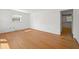 Spacious bedroom with hardwood floors, a window offering natural light, and white walls at 5321 Trudy St, North Charleston, SC 29418