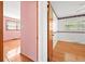 Bedroom with hardwood floors featuring a closet and adjoining room view at 5321 Trudy St, North Charleston, SC 29418