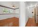 A bedroom with wood floors, a ceiling fan and windows letting in natural light at 5321 Trudy St, North Charleston, SC 29418