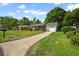 Charming single-story brick home with an attached single-car garage and a long driveway at 5321 Trudy St, North Charleston, SC 29418