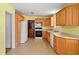 Functional kitchen with wood cabinets, updated appliances, and ample counter space at 5321 Trudy St, North Charleston, SC 29418