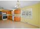 Open kitchen with wooden cabinets, modern appliances, and bright natural lighting at 5321 Trudy St, North Charleston, SC 29418