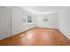 Bright living room with hardwood floors and plenty of natural light from large windows at 5321 Trudy St, North Charleston, SC 29418