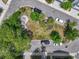 Aerial view of a small park in the neighborhood with a firepit, benches, picnic tables, and lush landscaping at 539 Cooper Village Ln, Mount Pleasant, SC 29464