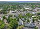 Aerial view of gray and white townhomes near a busy street with retail and commercial buildings at 539 Cooper Village Ln, Mount Pleasant, SC 29464