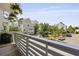Balcony view of neighborhood with multi-story homes, mature trees and a well-manicured yard at 539 Cooper Village Ln, Mount Pleasant, SC 29464