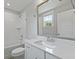 Bright bathroom featuring a tub and shower, white subway tile, and modern fixtures at 539 Cooper Village Ln, Mount Pleasant, SC 29464